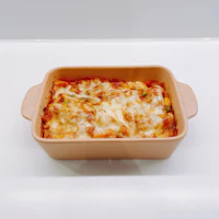 a dish of lasagna sitting on a table
