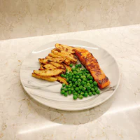 a plate of food on a marble counter