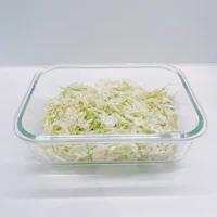 shredded cabbage in a glass dish