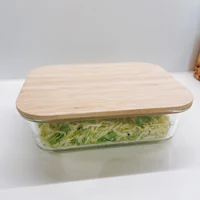 a wooden container with shredded cabbage in it